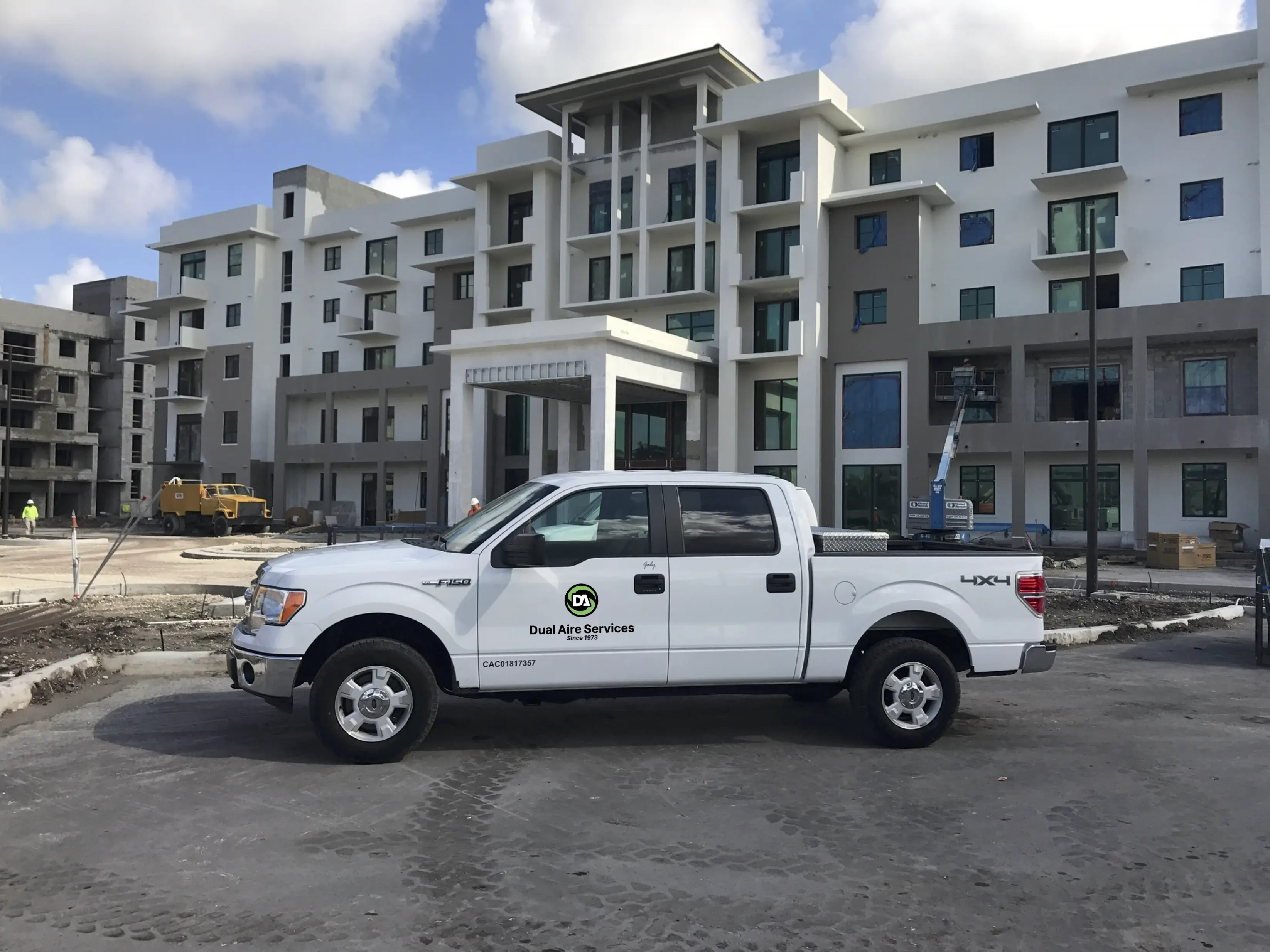 Dual Aire truck in front of a building